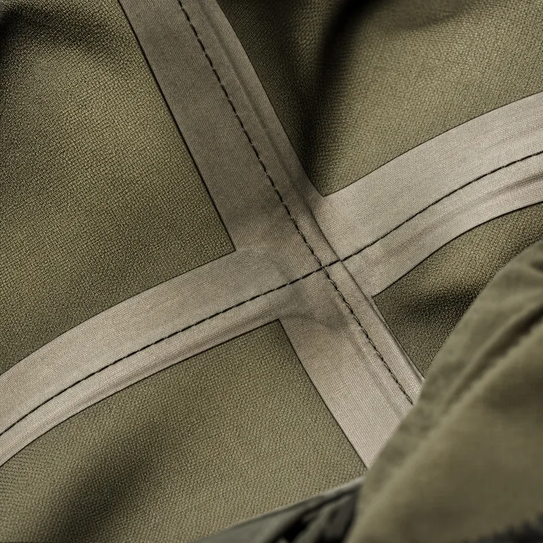 Close-up of taped seam construction inside a hunting shell