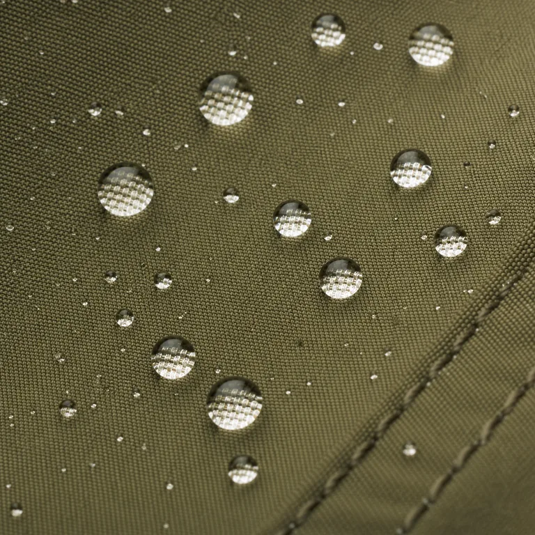 Water droplets beading on treated hunting fabric