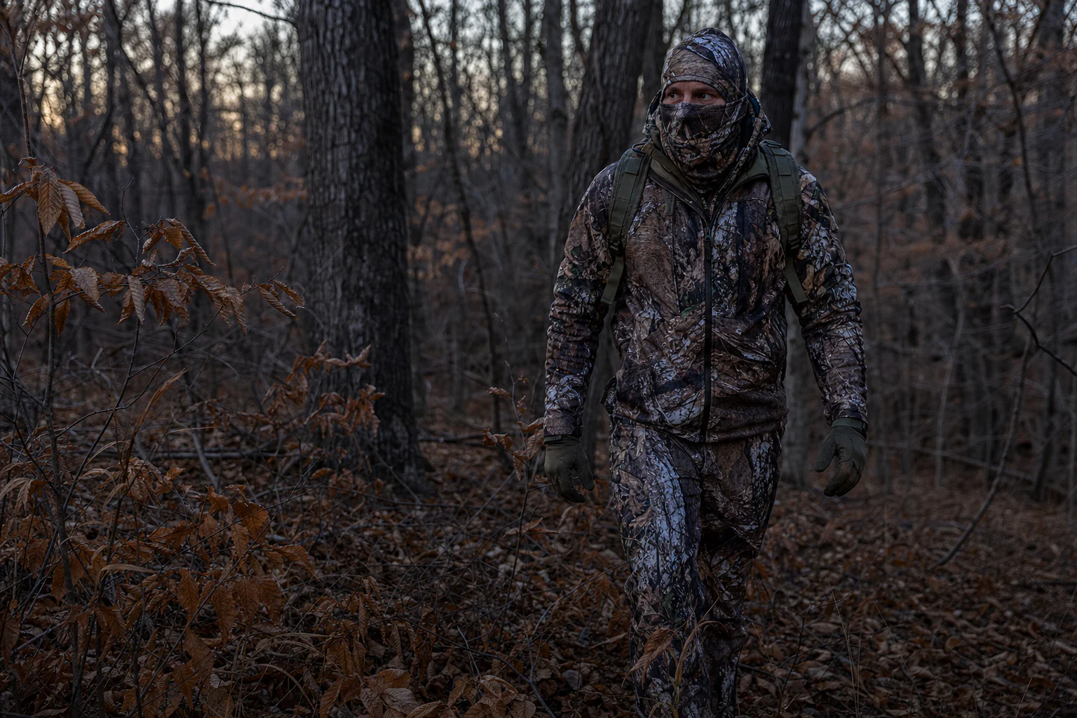 Hunter walking quietly through hardwood whitetail habitat