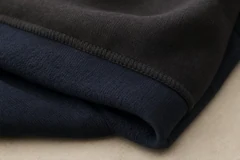 Close-up of a dark heavyweight streetwear fabric sample